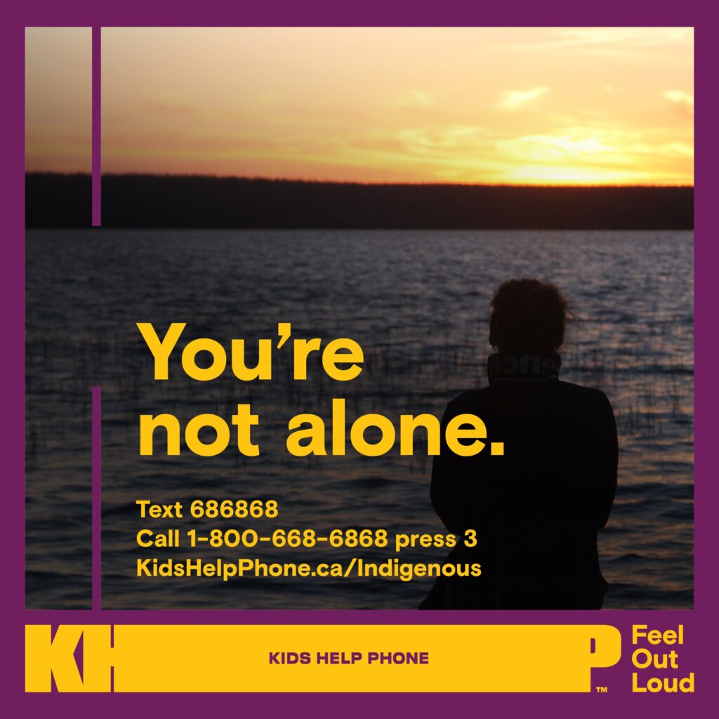 Kids Help Phone social card with contact info titled "You're not alone." Image of a person looking out to a body of water with a sunset. 