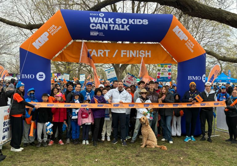 A group of people walking at events supporting youth such as BMO Walk so Kids Can Talk
