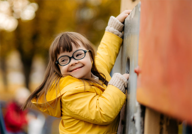 A young person playing on a playground during back-to-school season