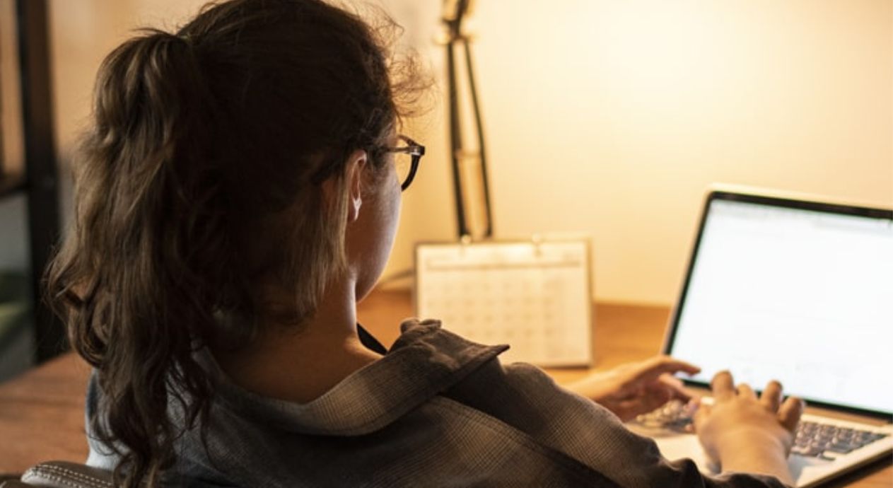 An image of a young person on their laptop looking up resources to cope with upsetting news