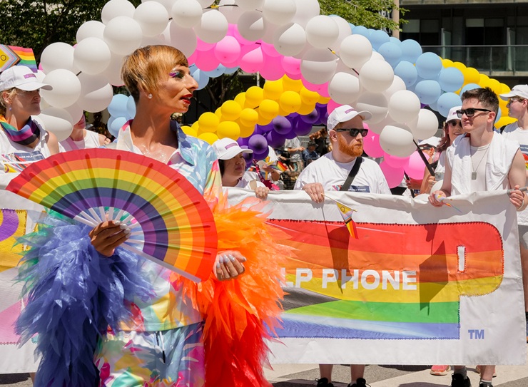 Kids Help Phone staff walking in a Pride parade