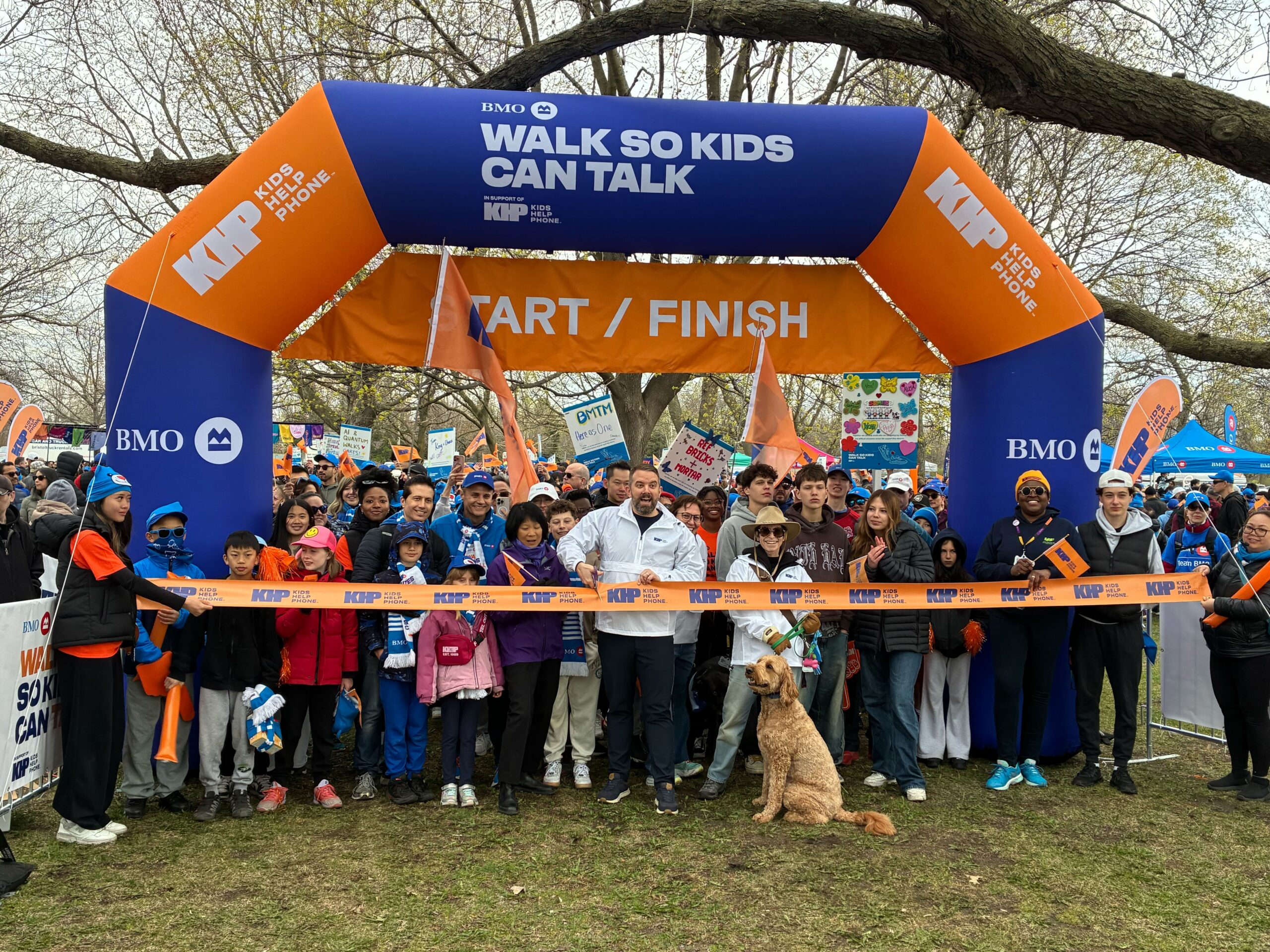 A group of people walking at events supporting youth such as BMO Walk so Kids Can Talk