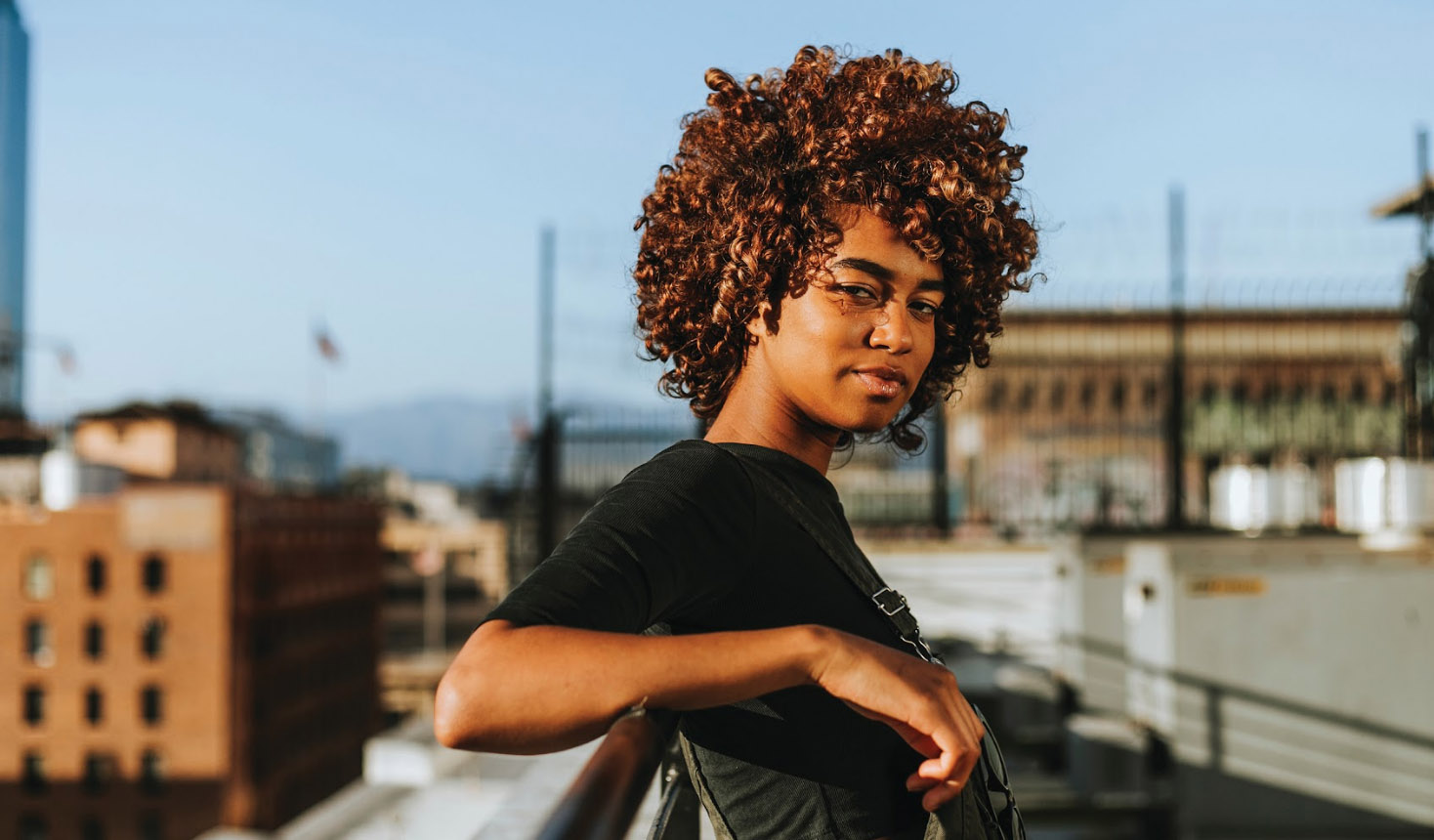 Illustration of diverse group of young people standing together with their arms around each other