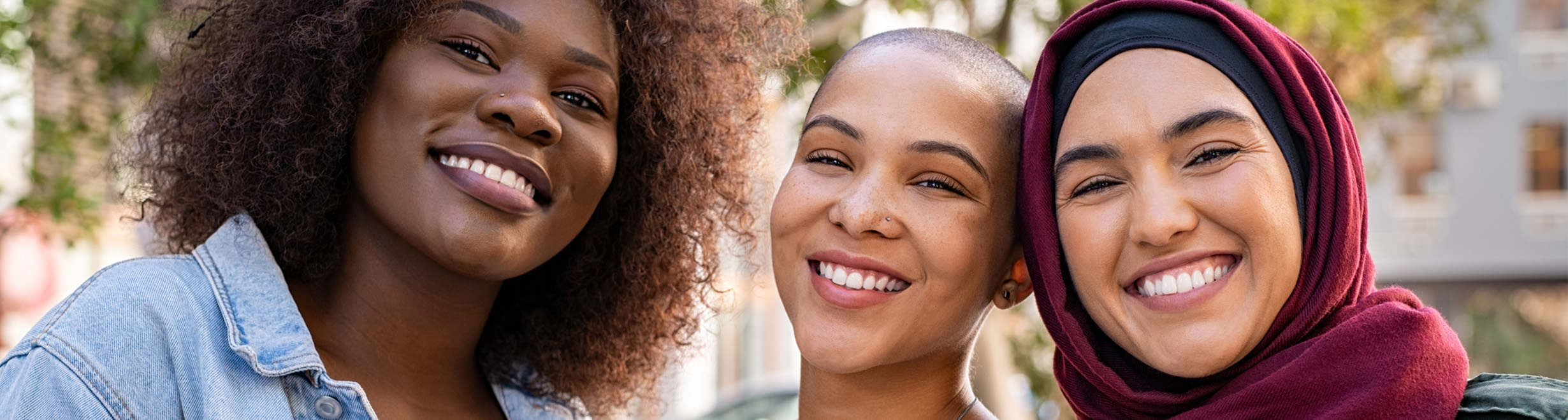 Young people outside smiling