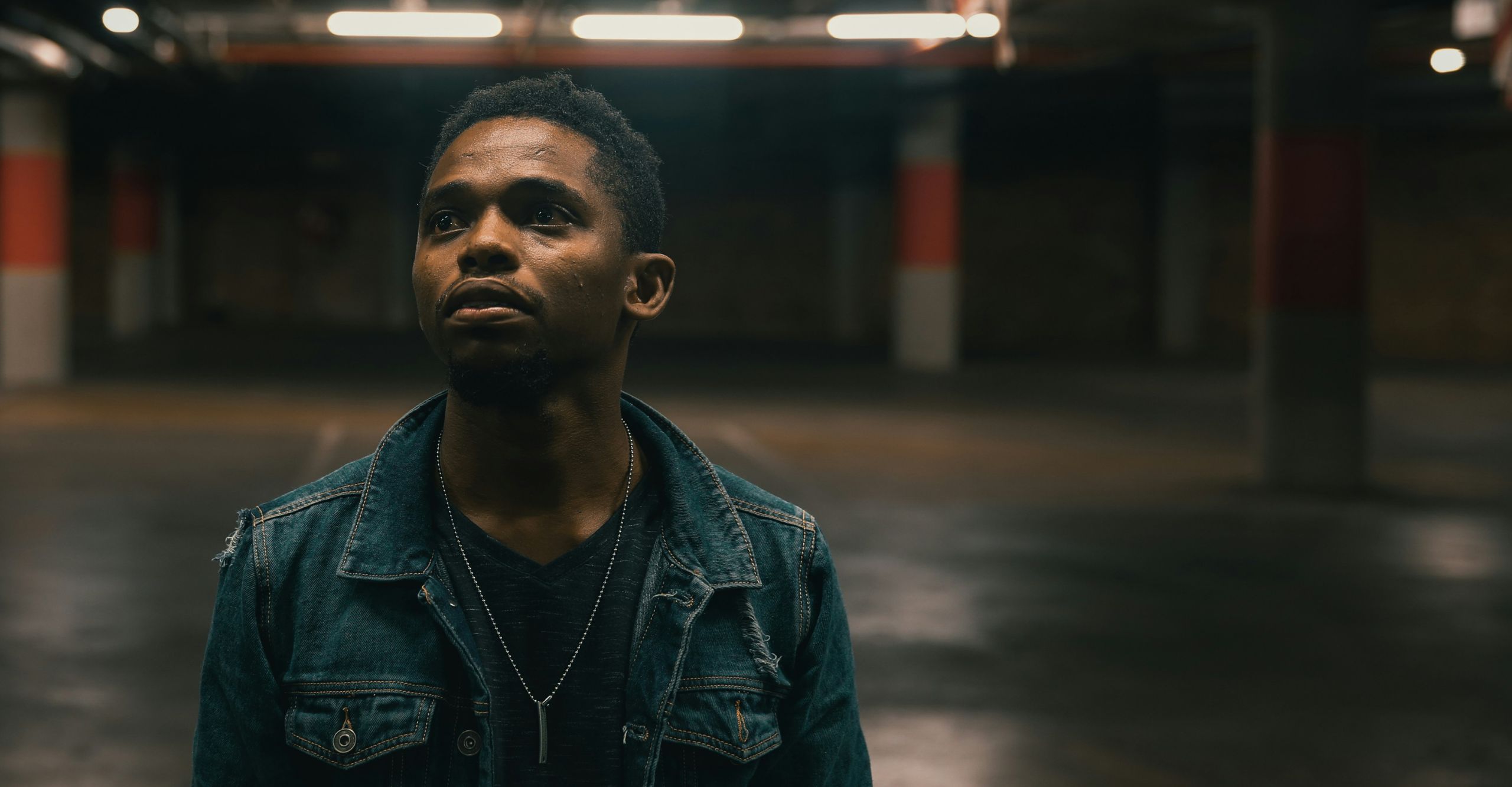 An image of a Black young person in a parking lot on a Kids Help Phone webpage