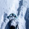 Close up of snow shoe stepping in snow